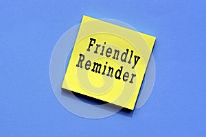 Friendly reminder text on yellow sticky note photo