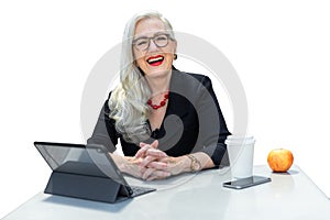 Friendly senior advisor, consultant, manager, business person CEO, sitting at desk with a friendly smile, isolated on white backgr