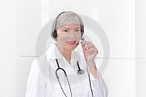 Friendly senior doctor headset microphone