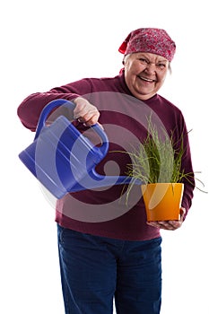 Friendly senior holding a watering can