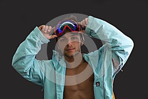 Friendly skier or snowboarder with open jacket