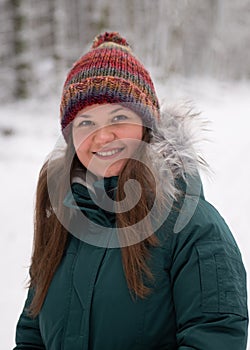 Friendly Smile in the Winter Woods: Woman in a Snowy Scene