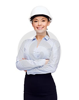 Friendly smiling businesswoman in white helmet