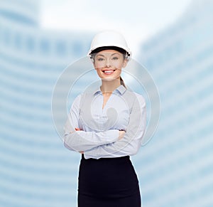 Friendly smiling businesswoman in white helmet