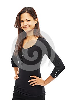 Friendly and smiling. Studio portrait of an attractive young woman with her hands on her hips isolated on white.