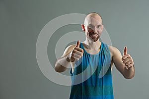Friendly sportsman giving thumbs up