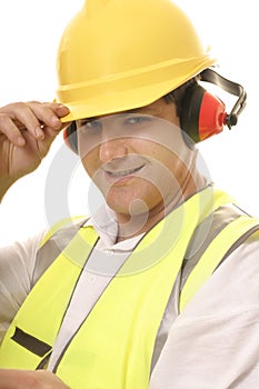 Friendly tradesmen tipping his hat photo