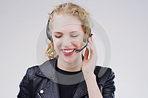 The friendly voice on the other end of the line. Studio shot of an attractive young female customer service