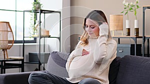 Friendly Woman Expecting Childbirth And Resting On Sofa At Home