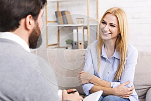 Friendly woman patient talking to psychological consultant