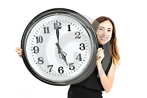 Friendly woman showing the the time