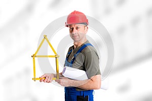 Friendly worker with yardstick- house and blueprint