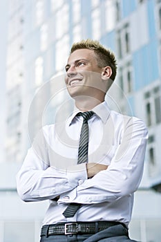 Friendly young business executive smiling