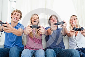 Friends all playing video games together