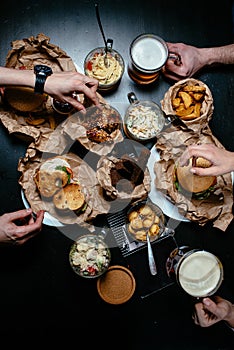 Friends all together at restaurant having meal top view