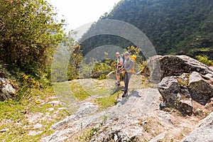 Friends backpackers men tourists posing jungle trail edge, Bolivia.