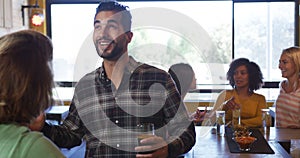 Friends at the bar in a pub during the day