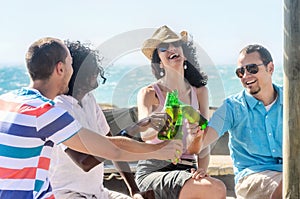 Friends at a beach party having drinks