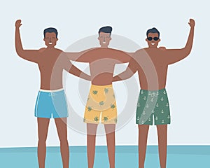 Friends in beach shorts stand against the background of the sea. Three young men in swimming trunks stand together