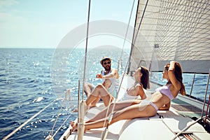 Friends on boat enjoying on summer day