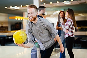 Friends bowling at club