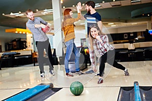 Friends bowling at club