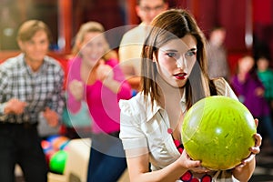 Friends bowling having fun