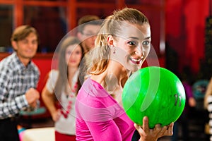 Friends bowling having fun