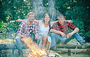 Friends camping in forest. Company having hike picnic nature background. Friends enjoy weekend barbecue in forest