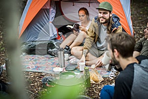 Friends camping in the forest together