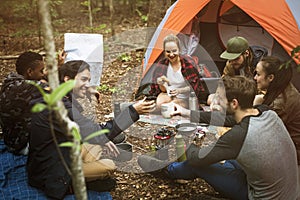 Friends camping in the forest together