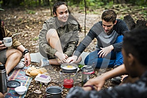 Friends camping in the forest together