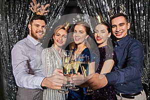 Friends with champagne glasses at christmas party