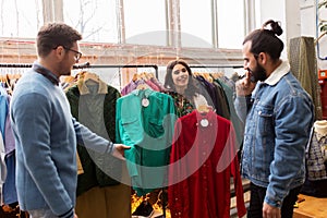 Friends choosing clothes at vintage clothing store