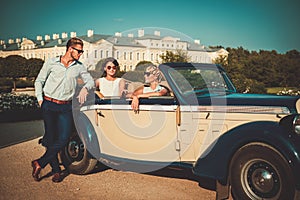 Friends in a classic convertible