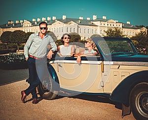 Friends in a classic convertible