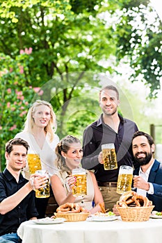 Friends or colleagues on beer garden after work