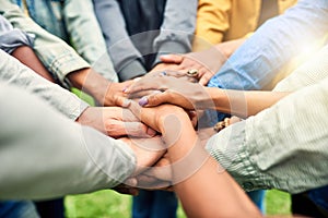 Friends, community and stack of hands of people for motivation, support and friendship goal outdoor. Teamwork, diversity