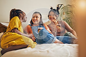 Friends, conversation and women with drink in home for relaxing, bonding and talking together. Friendship, happy and