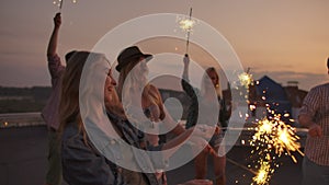 Friends are dancing on the evening open air party