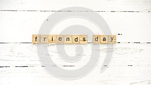 Friends ` day.words from wooden cubes with letters photo