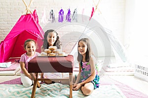 Friends With Donuts Enjoying Sleepover Party At Home