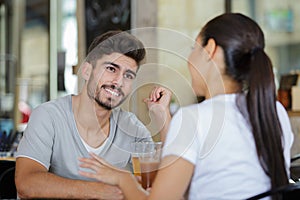 friends drinking beer talking having fun