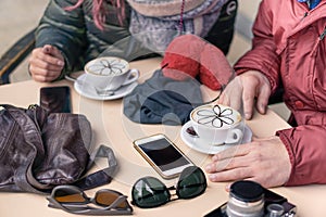 Friends drinking cappuccino at coffee bar restaurants