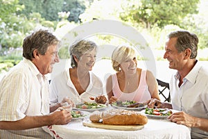 Friends Eating An Al Fresco Lunch