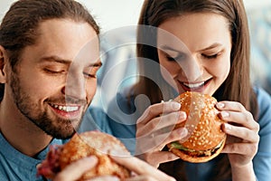 Friends Eating Burgers Indoors