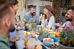 Friends eating and chating in cafee outdoor photo