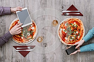 Friends eating pizza together