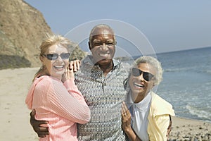 Friends embracing on beach