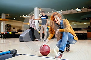 Friends enjoying bowling at club